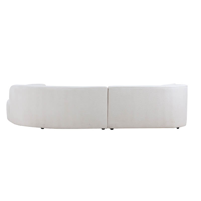 Elegant 126" curved luxury sofa set with chaise in a bright living room.