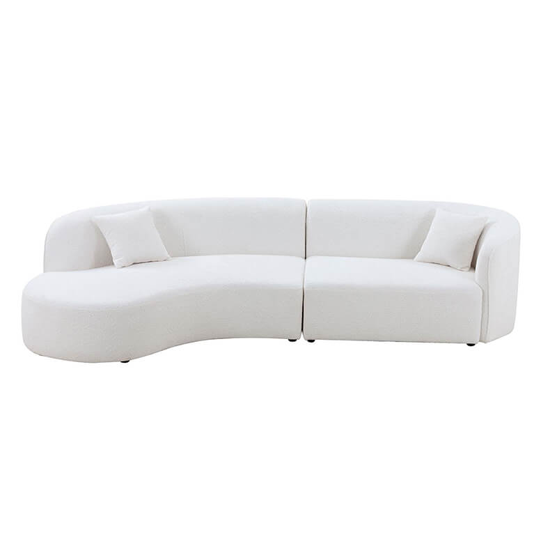 Close-up of the plush foam padding on the modern curved sofa.