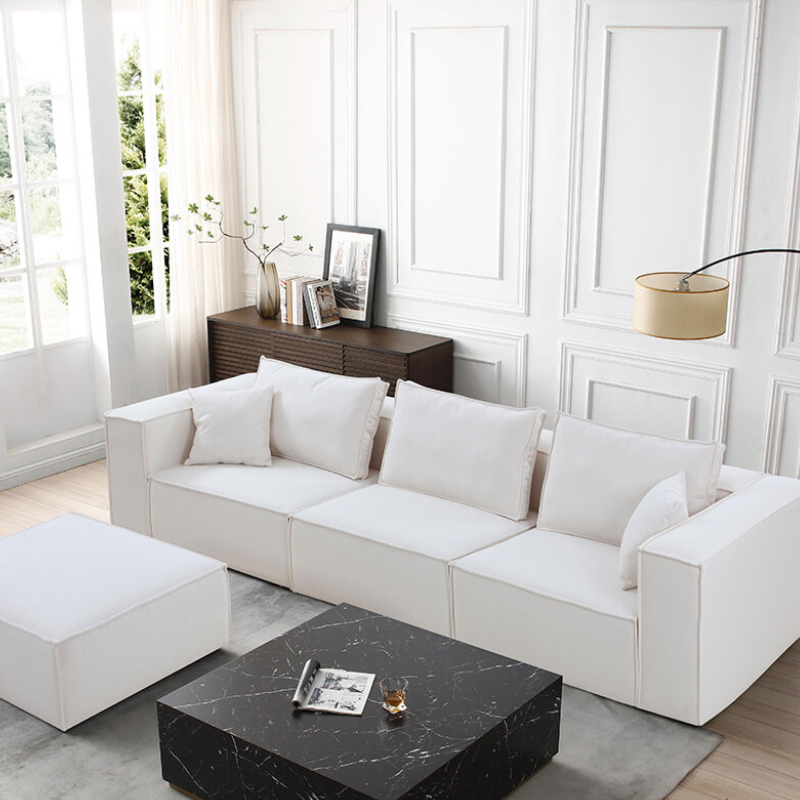 Chic modular white sectional sofa showcasing spacious seating and clean lines.