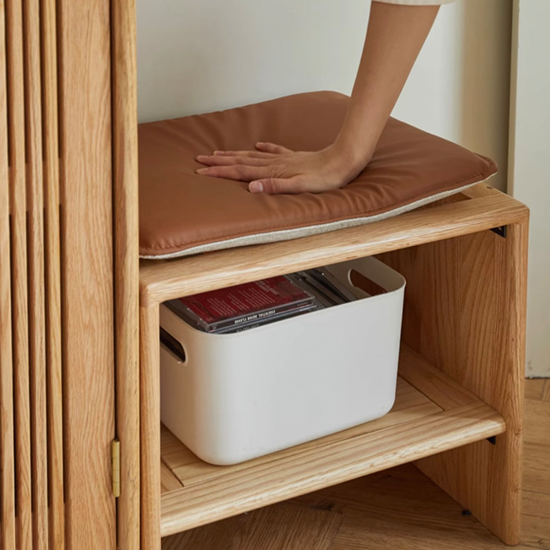 Side view showing the cabinets key and umbrella hanging features, emphasizing its creative shoe storage solutions.