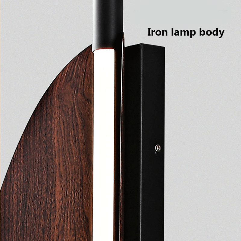 Scandinavian Wood Grain Wall Lamp installed in a cozy living room, illuminating the space beautifully.