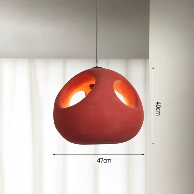 Nordic handwoven pendant light showcasing its intricate design and warm red hue.