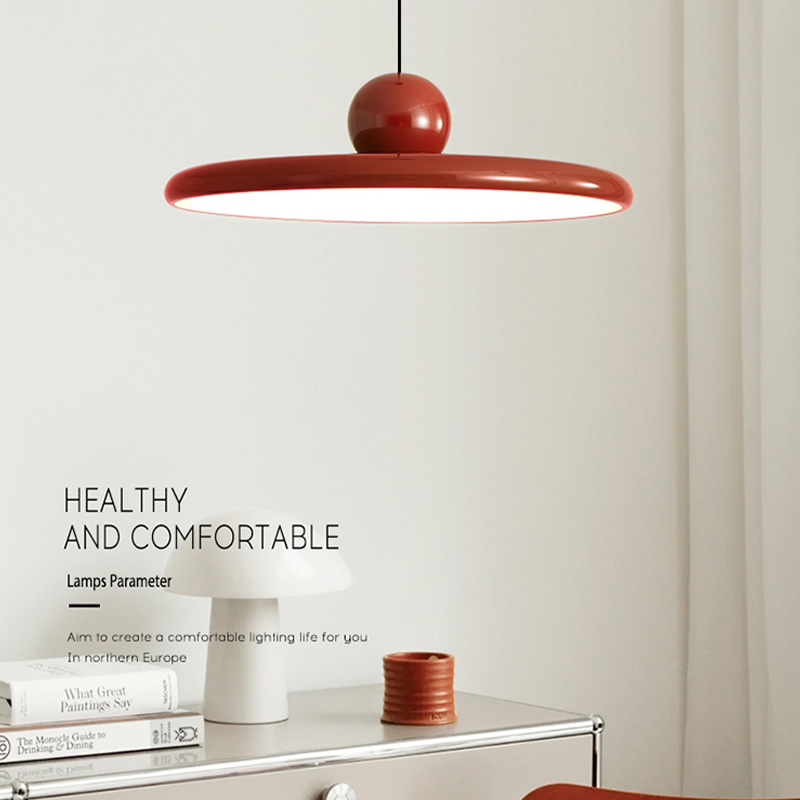 Modern kitchen with the flying saucer pendant light illuminating the island.