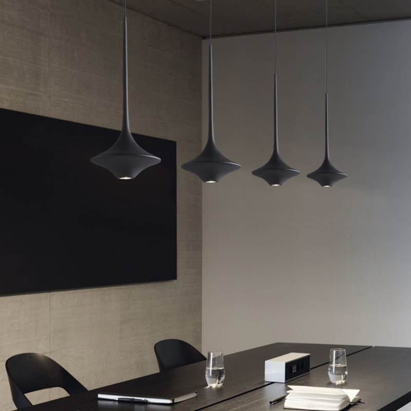 Sleek LED pendant light in a modern dining room setting, highlighting its elegant design and soft illumination.
