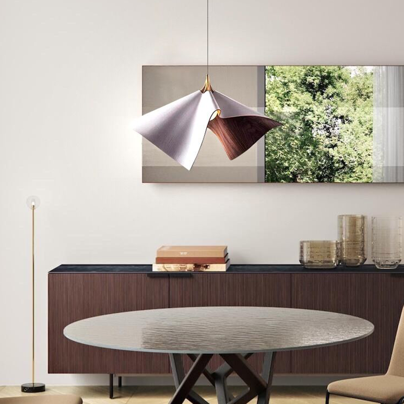 Side view of the pendant light highlighting its unique pleated design and structure.