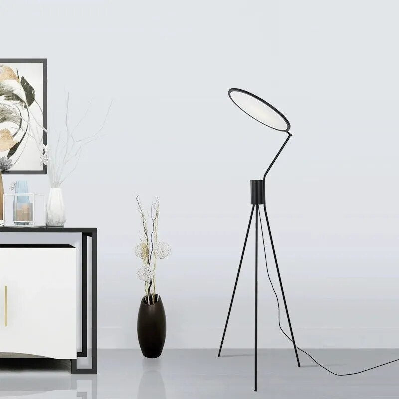 Elegant view of the LED tripod lamp in a modern living room setting, showcasing its warm light and stylish design.
