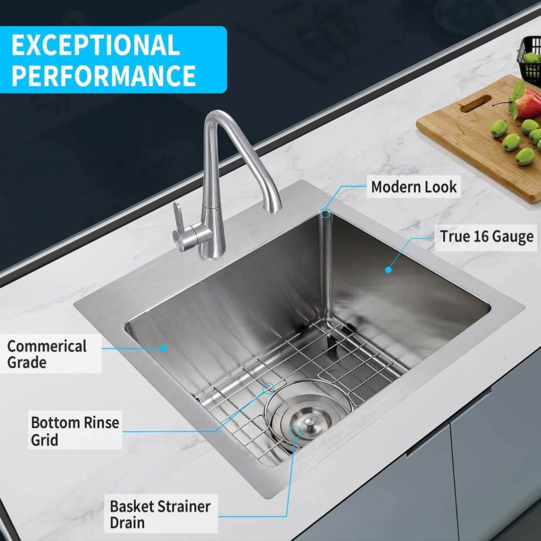 Close-up of the included accessories for the 15-inch kitchen sink, including the dish grid and drain assembly.