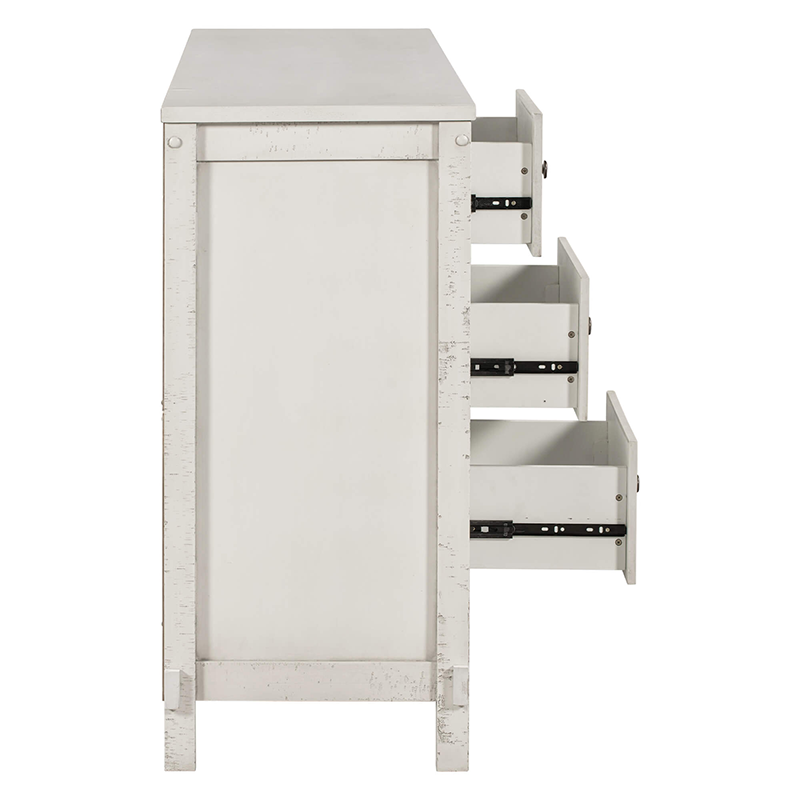 Close-up of the antique white buffet cabinets metal knobs and distressed wood finish.