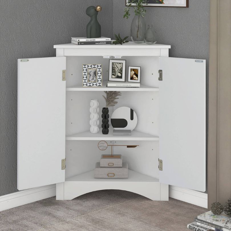 Close-up of the modern white corner cabinets triangular design, perfect for small bathroom spaces.