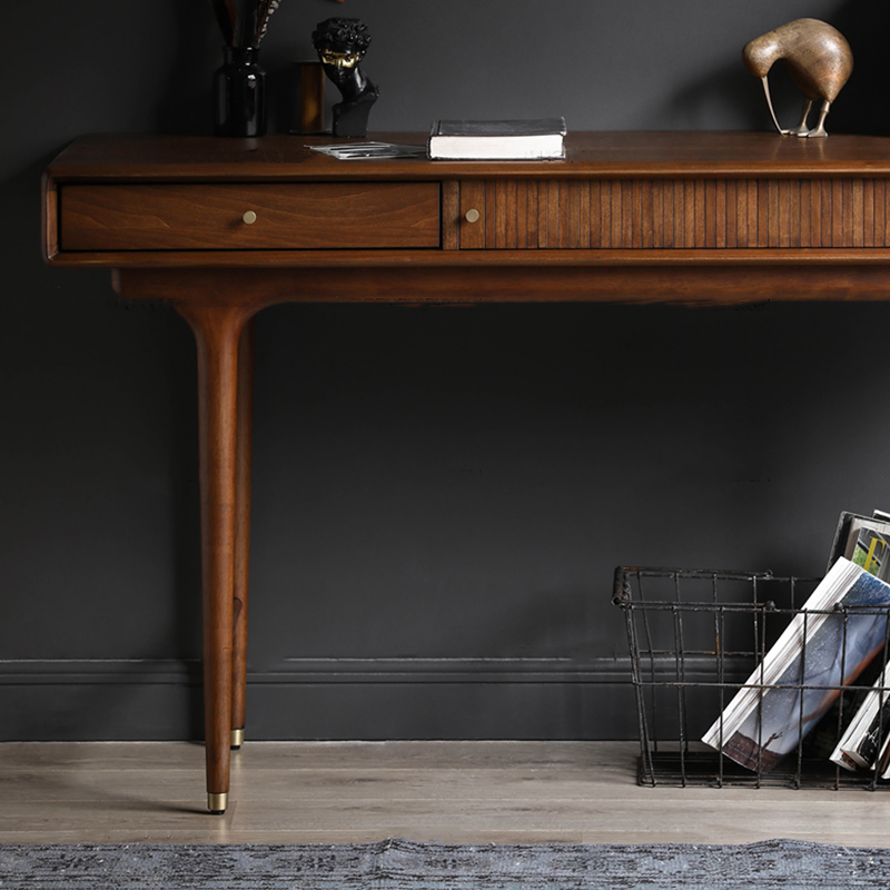 Desk styled in a modern office setting, adorned with a laptop and decorative items, showcasing its versatility.