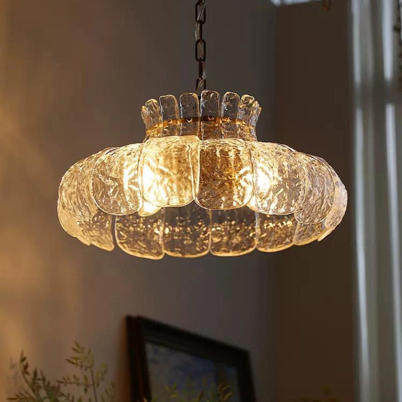 Chic French flower petal glass pendant light hanging in a modern kitchen
