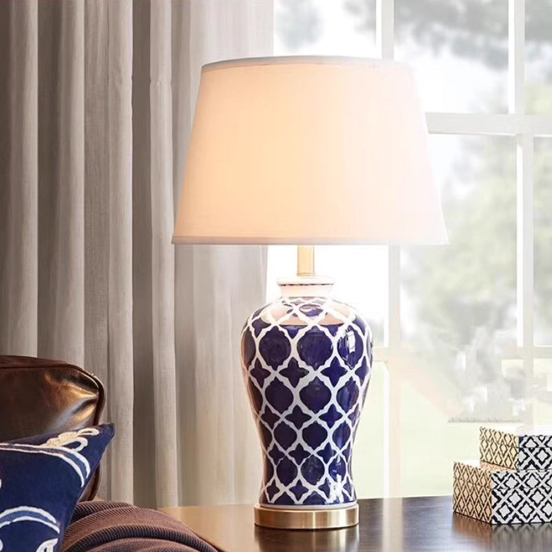 Front view of ceramic lamp showing hand-painted blue floral designs