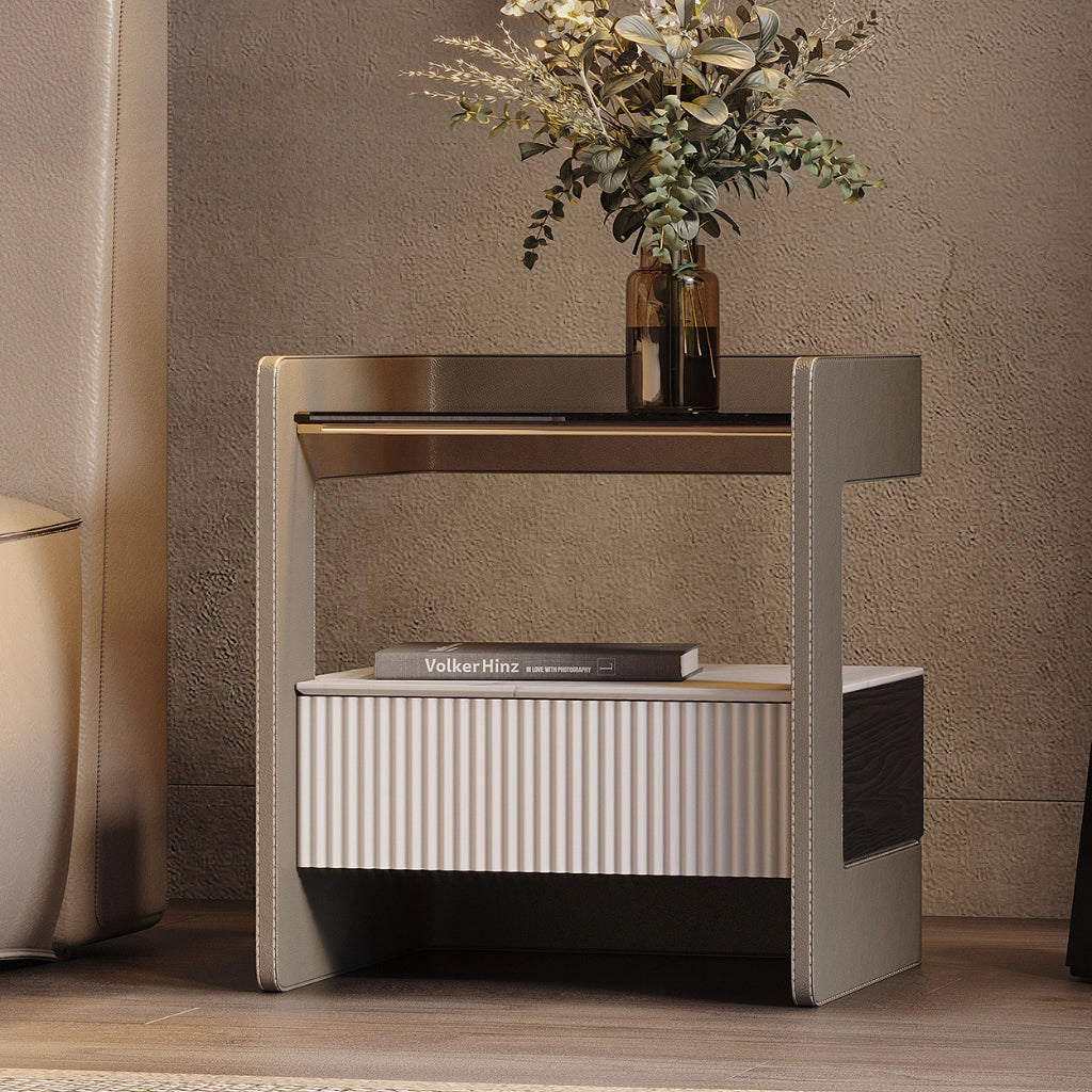 Front view of sleek minimalist nightstand with glass accents in a modern bedroom.