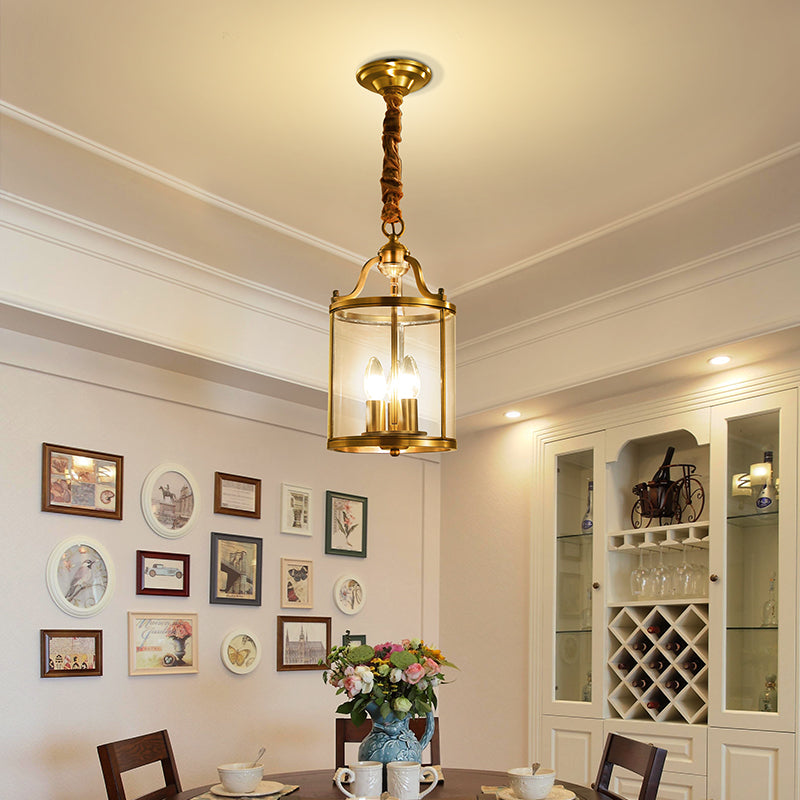 Elegant European crystal pendant light showing three bulbs and clear glass shades from the side.