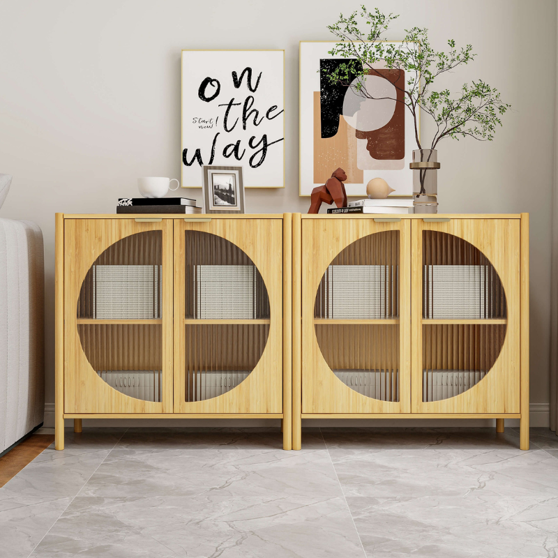 Bamboo storage cabinet with glass doors showcasing kitchen items inside.