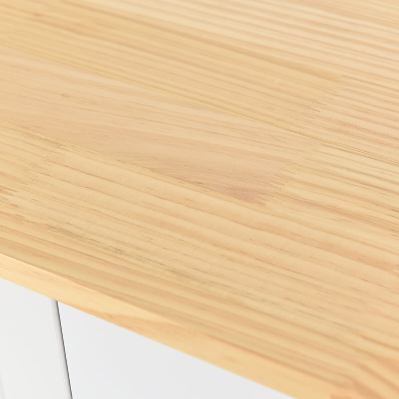 Side angle of the white kitchen island cart featuring a built-in spice rack and towel holder for added convenience.