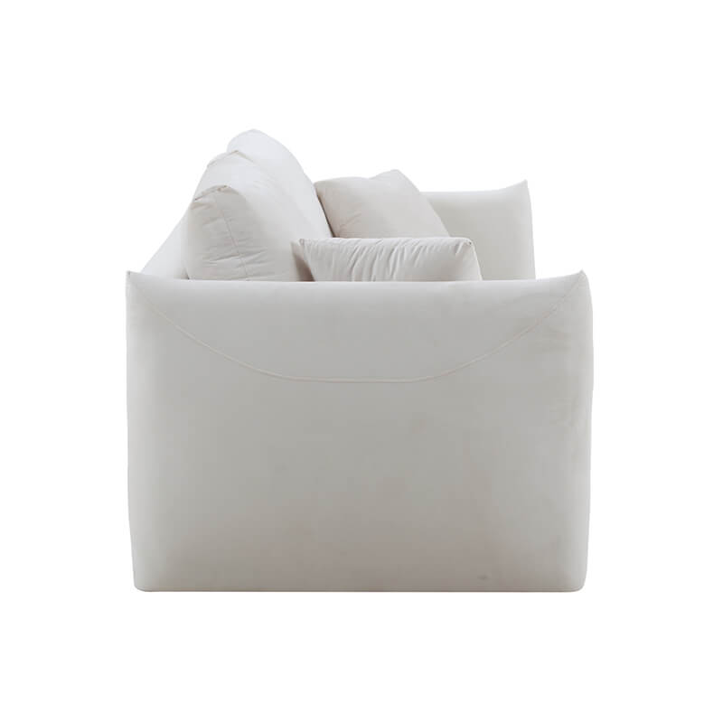 Elegant beige sectional sofa with three plush pillows, perfect for modern living rooms.