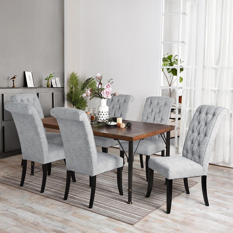 Angle view of rustic brown poplar wood dining table with black metal legs, showcasing its stylish design.