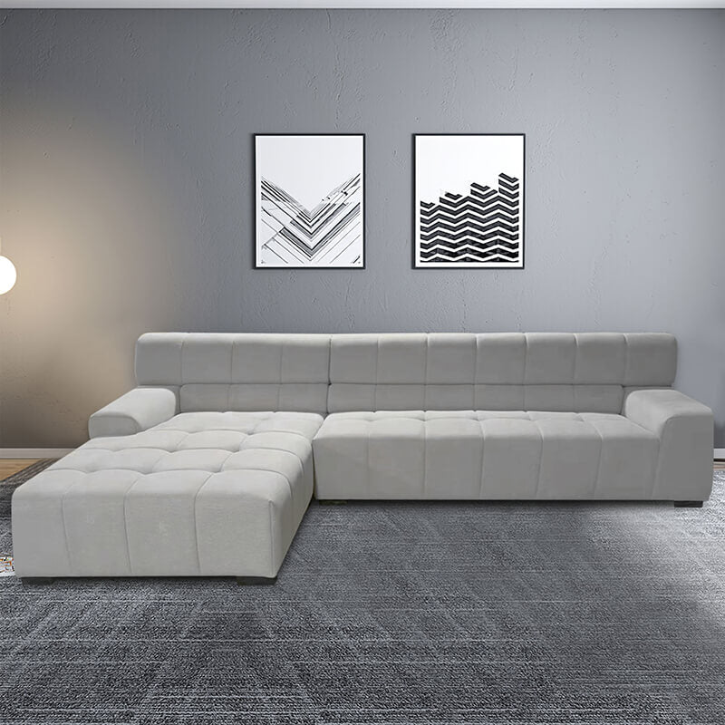 Front view of the stylish light grey modern upholstered sectional sofa, showcasing its soft fabric.