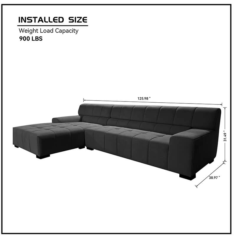 Comfortable dark grey sectional sofa viewed from the side, highlighting its sleek lines and durable construction.