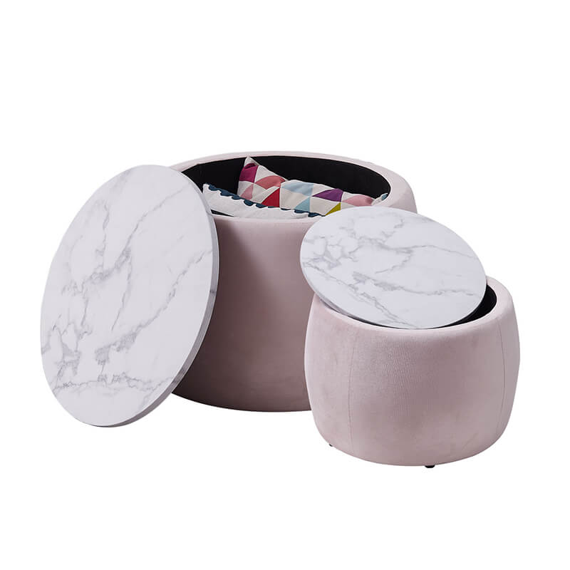 Side angle showing plush velvet texture and wooden tabletop surface of the larger ottoman