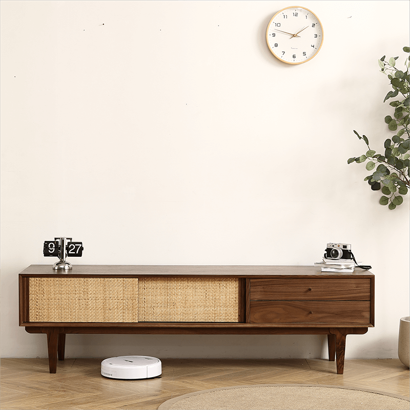 Elegant rattan TV stand showcasing its sleek black walnut finish and spacious shelves.