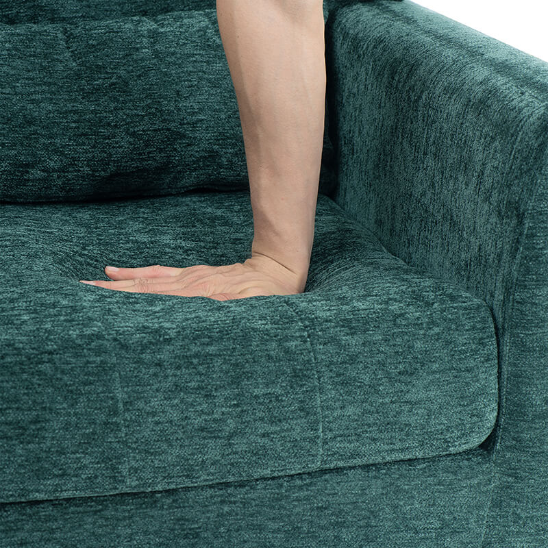 Cozy setup with the green upholstered chair in a stylish living room setting.