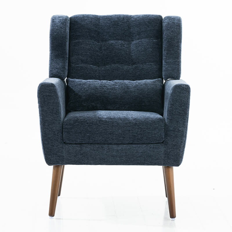 Dark blue upholstered accent chair in a stylish living room setting.