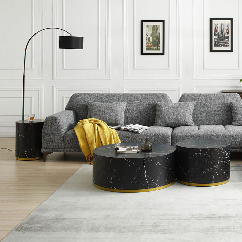 Elegant black marble round coffee table set displayed in a modern living room.