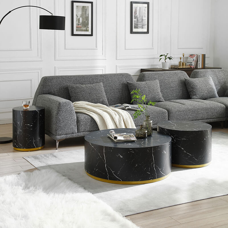 The three coffee tables stacked together, showing their space-saving design.