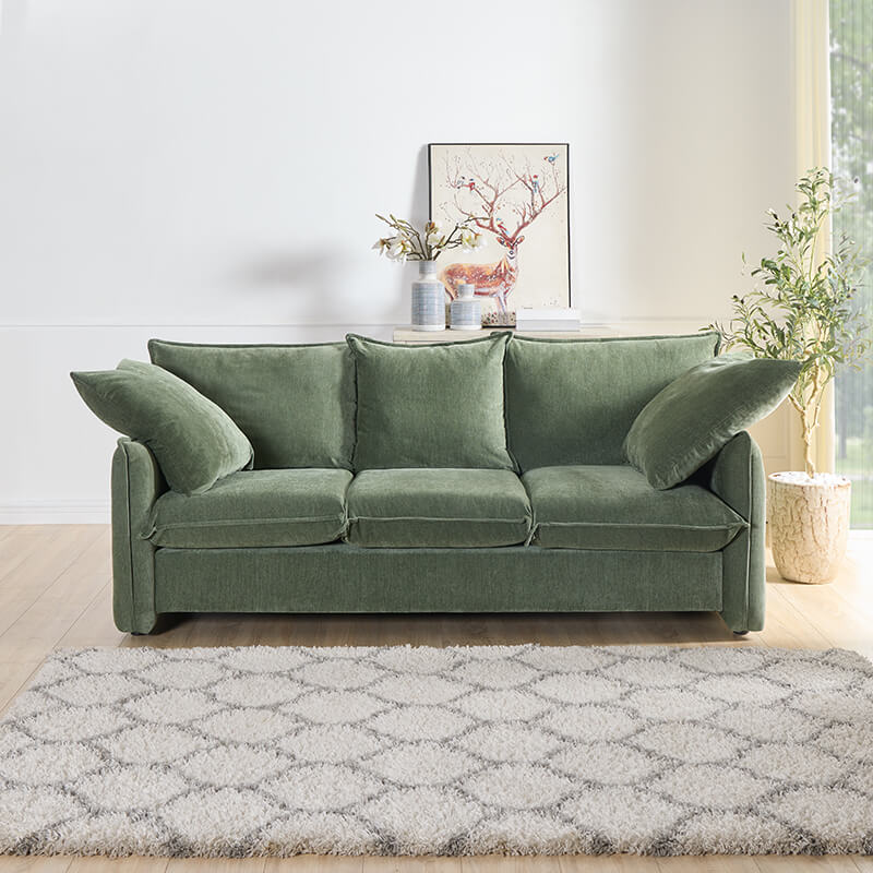 Elegant green mid-century modern sofa from the side, showcasing soft cushions and armrests.