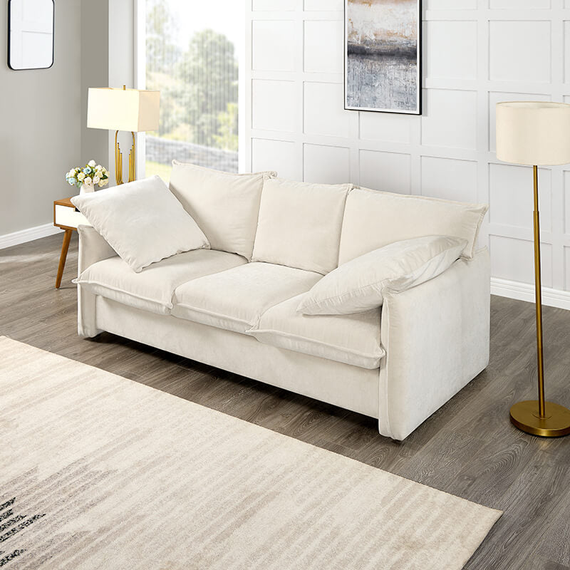 Elegant mid-century beige 3-seater sofa in a cozy living room setting with decorative pillows.