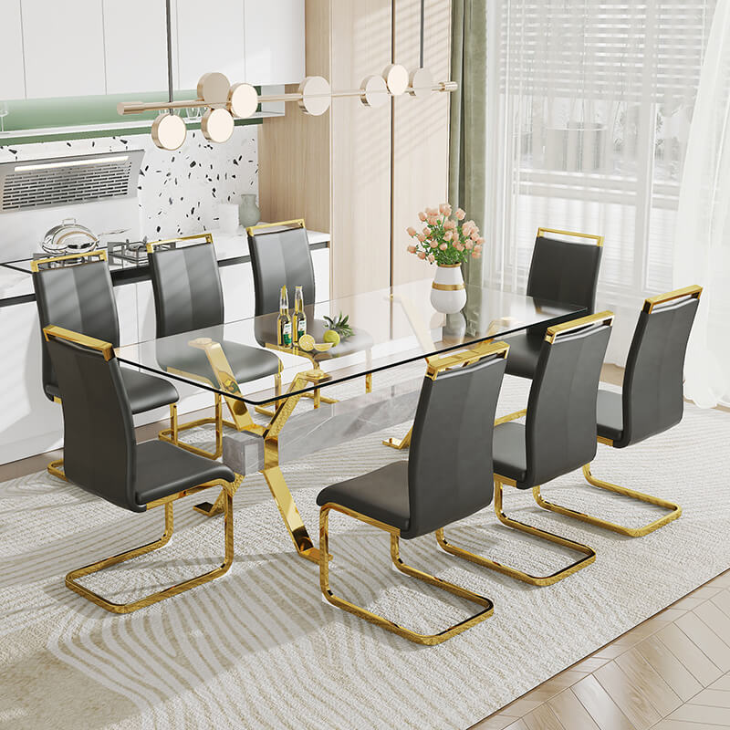 Close-up of gold-plated metal legs and glass edge detailing on the dining table