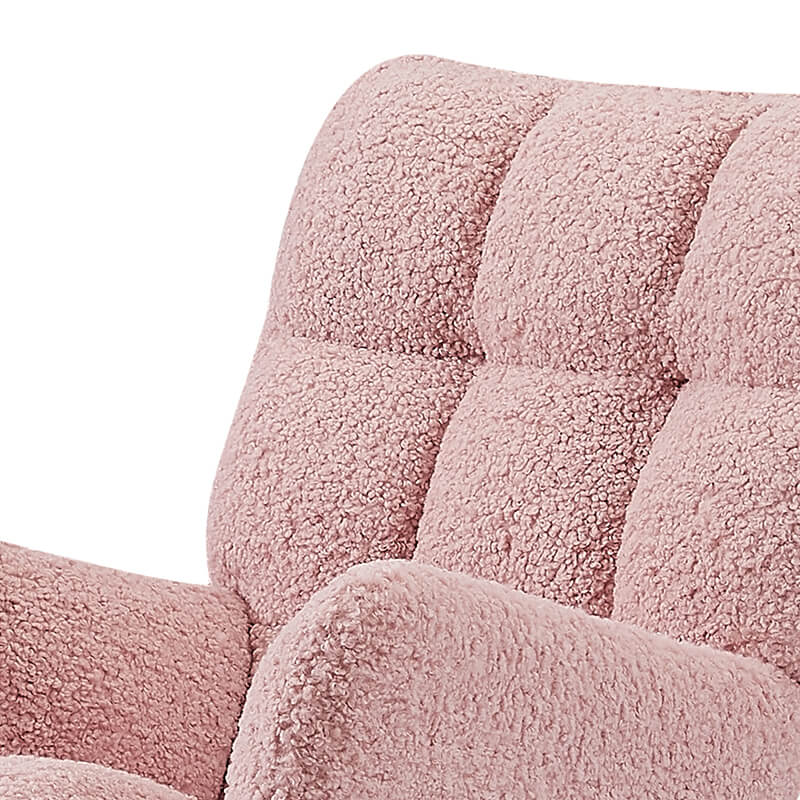 Close-up of the pink boucle upholstered rocking chair showcasing its soft fabric and ergonomic design.