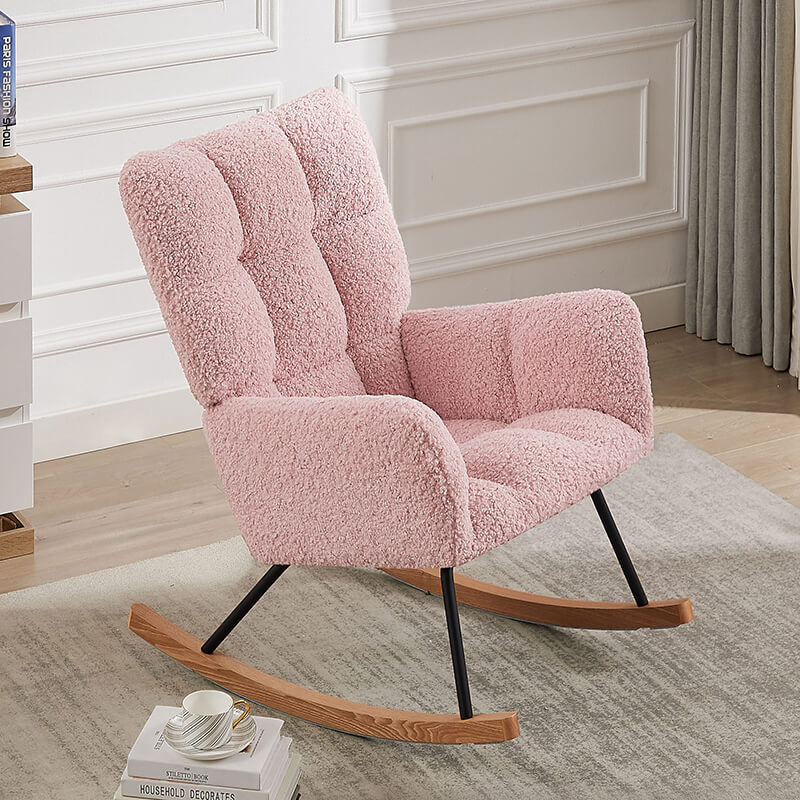 Close-up of the pink boucle upholstered rocking chair showcasing its soft fabric and ergonomic design.