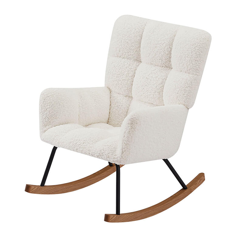 View of the beige upholstered rocking chair with high backrest in a bright nursery setting.