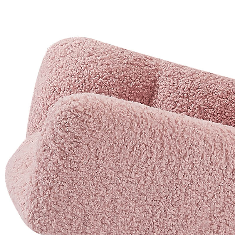 Side view of the rocking chair in a cozy nursery setting, emphasizing its armrests and overall comfort.
