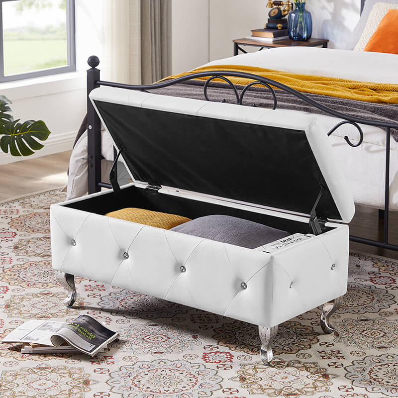Top view of the white ottoman with the lid open, revealing its spacious storage compartment.