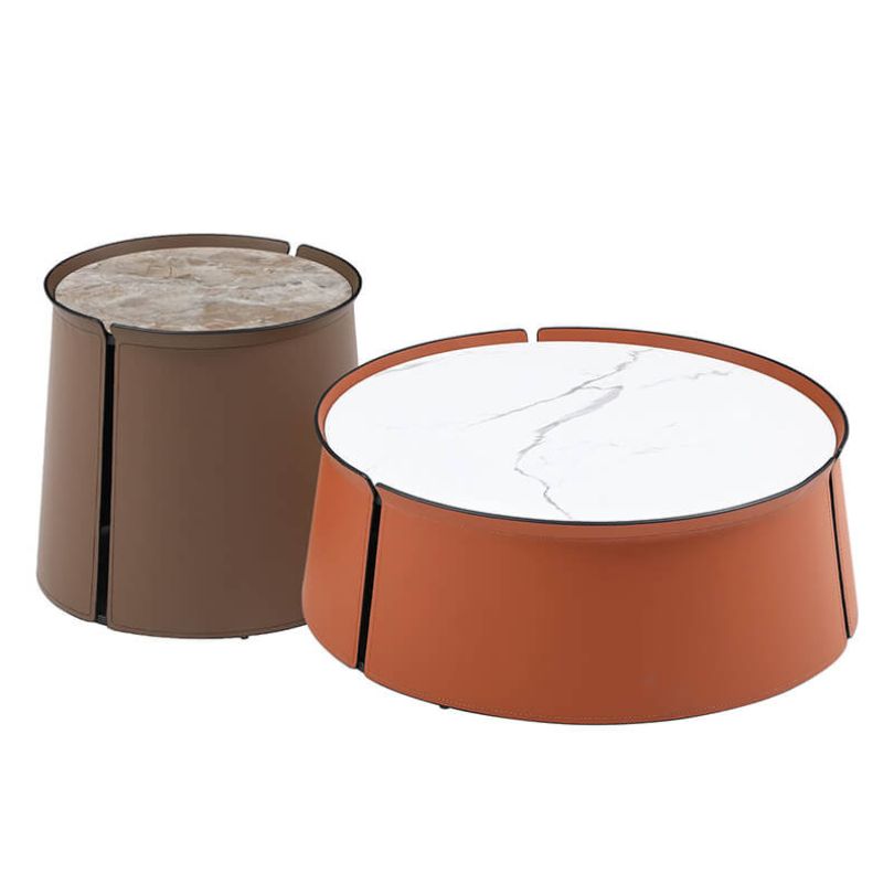 Elegant saddle leather coffee table with brown marble top, showcasing the round shape and luxurious finish.