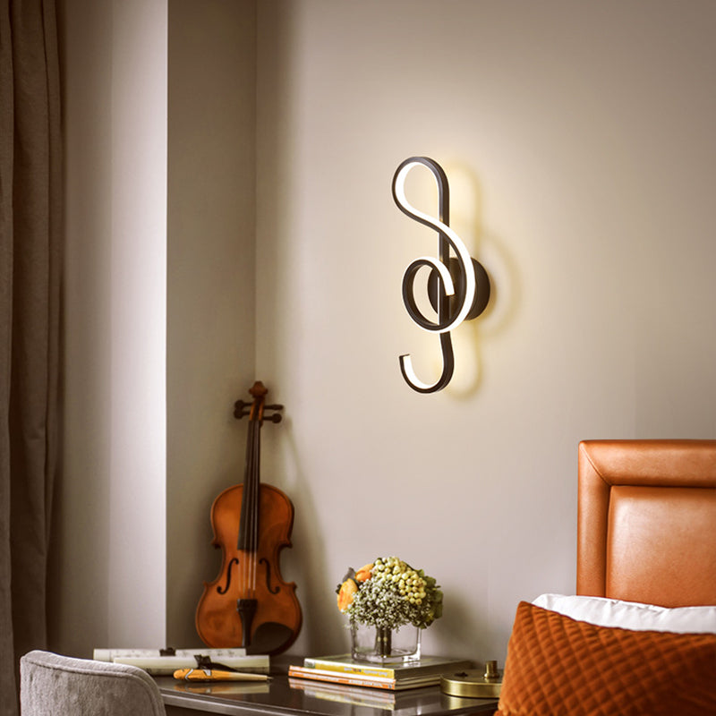 Front view of LED wall light illuminating a bedroom with soft upward glow