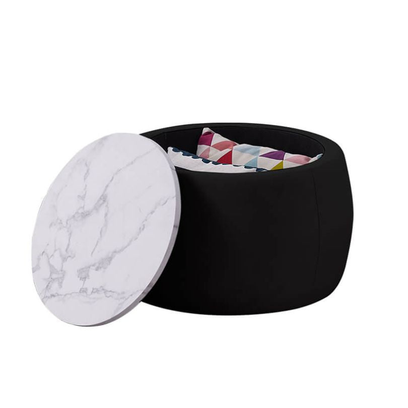 Close-up of velvet and marble-textured finish on round coffee table ottoman