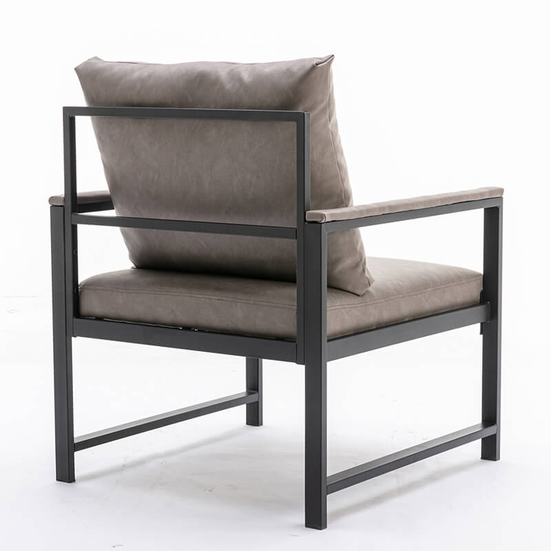 Lifestyle shot of the modern gray PU leather accent chair in a stylish living room setting.