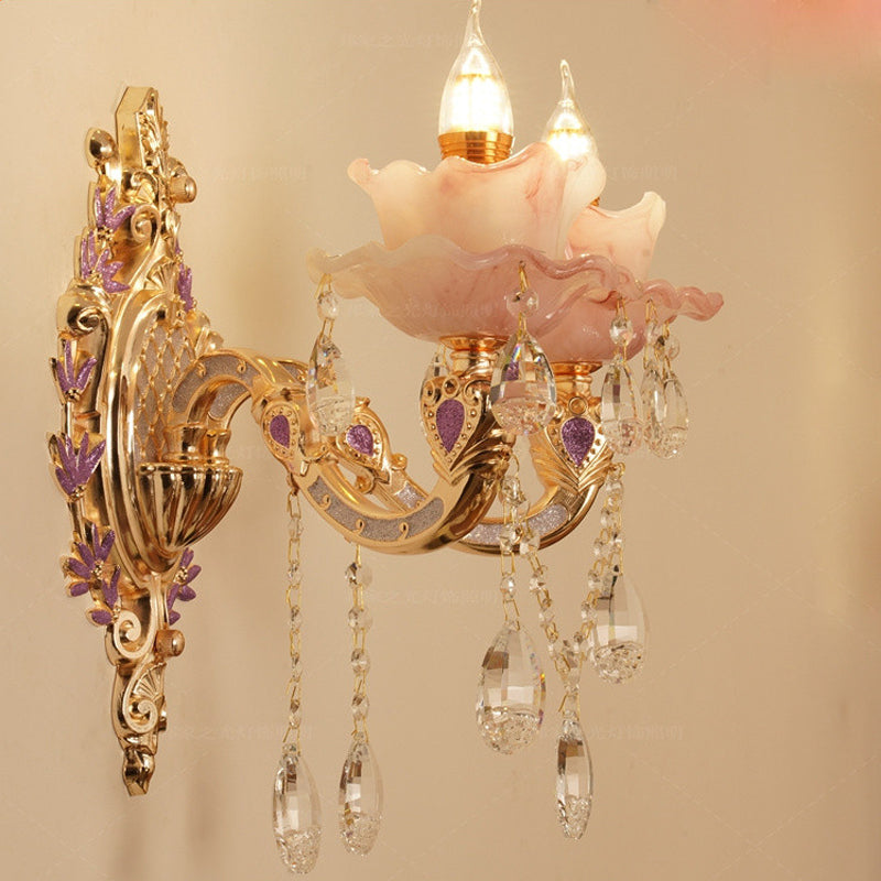 Close-up view of a modern LED wall light highlighting its intricate crystal lampshade.