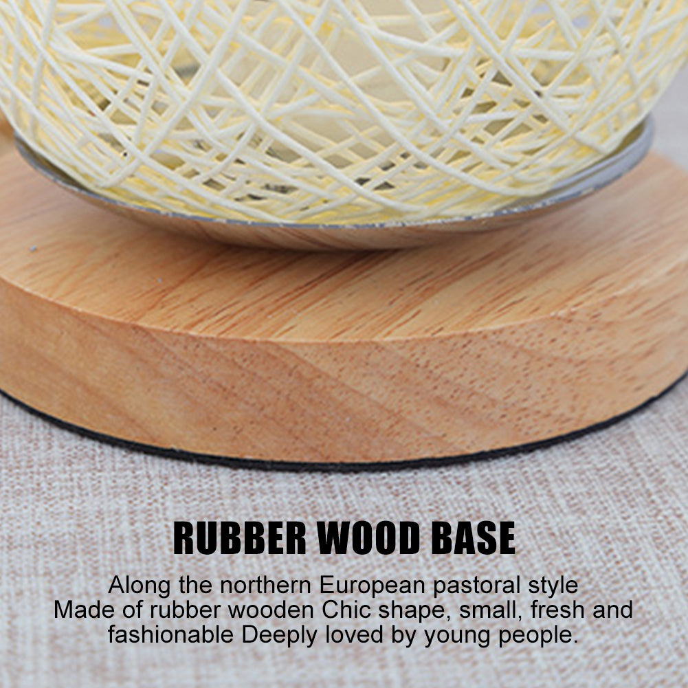 Close-up of the rattan lamp showcasing its bamboo wood base and dimmable LED feature.