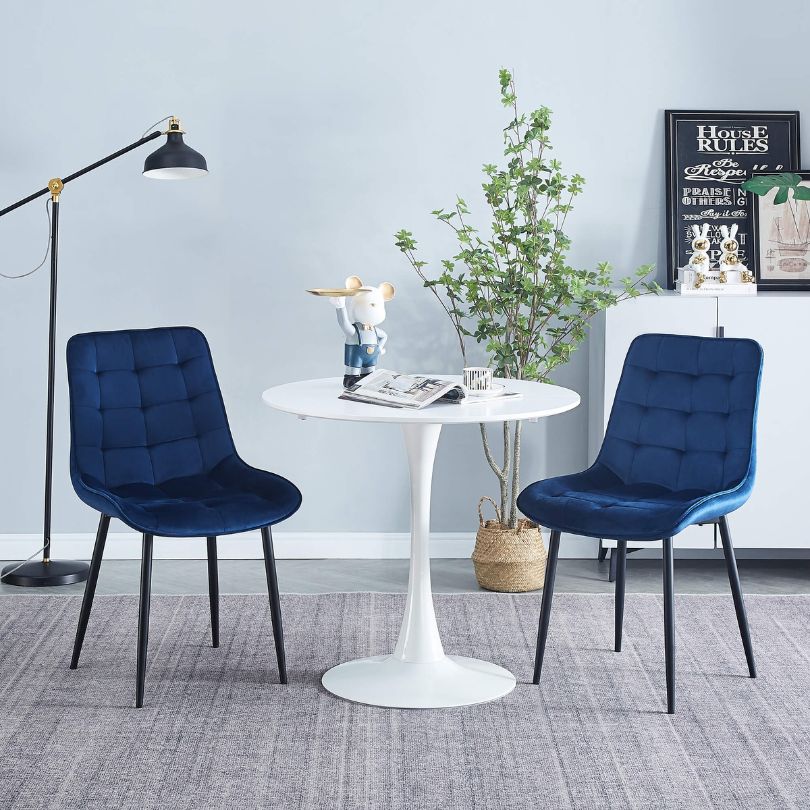 Stylish blue dining chairs in a modern dining room setting, perfect for gatherings.