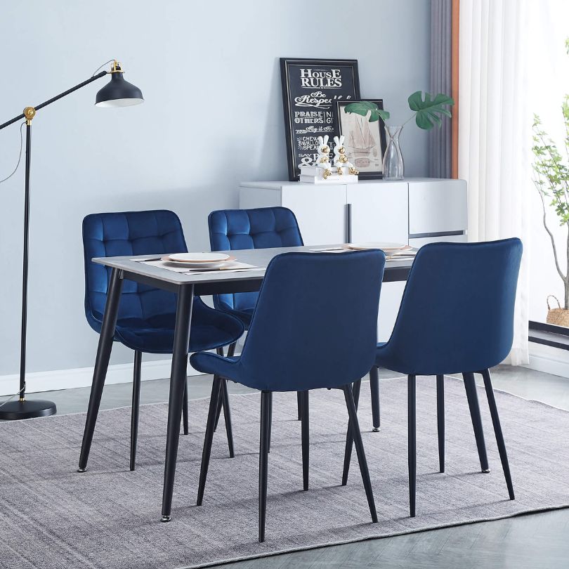 High back modern dining chairs with sleek black powder steel legs, enhancing contemporary decor.