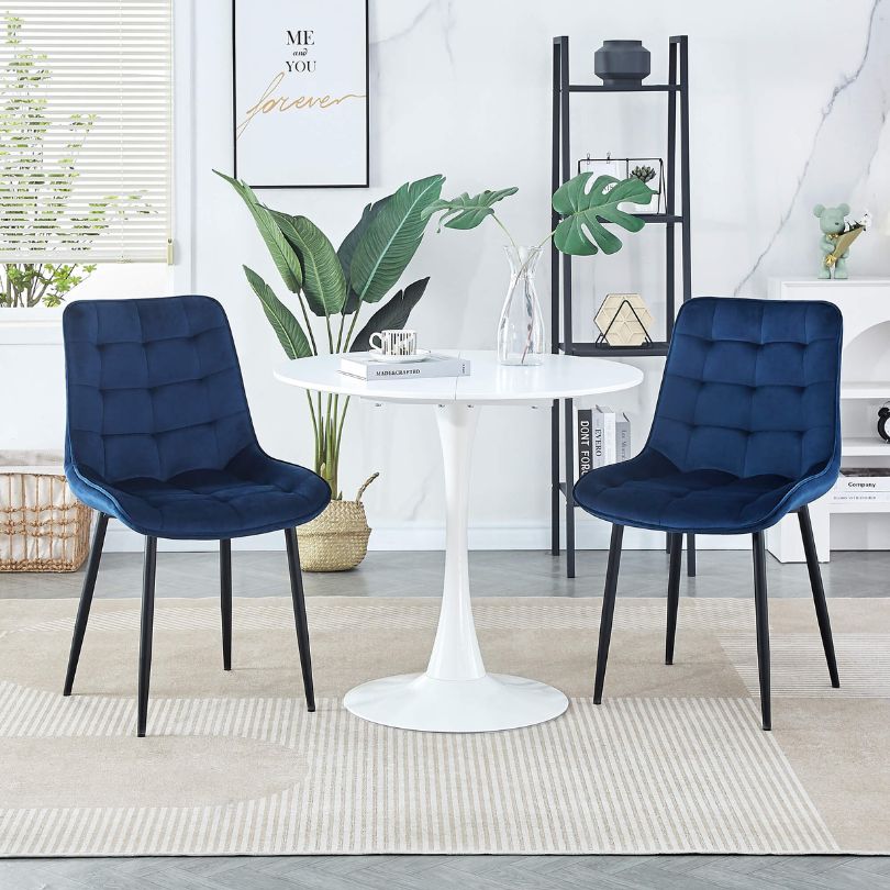 Stylish blue dining chairs in a modern dining room setting, perfect for gatherings.