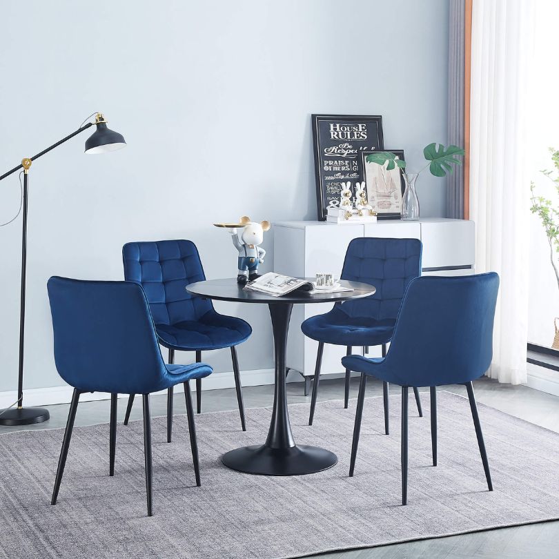 Elegant blue velvet dining chair set showcasing ergonomic design and plush comfort.