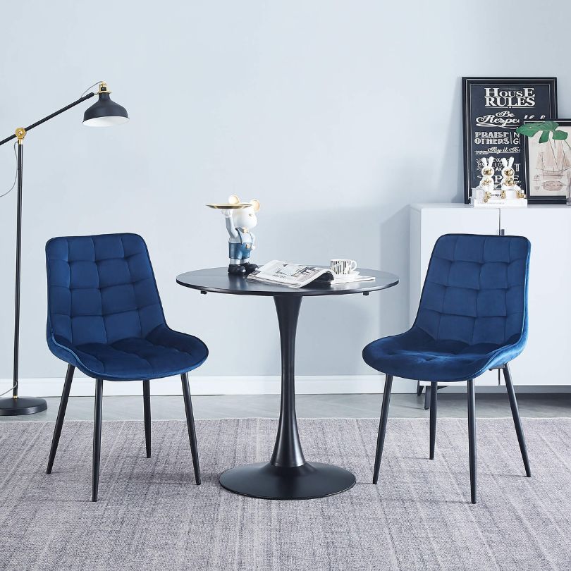 Elegant blue velvet dining chair set showcasing ergonomic design and plush comfort.