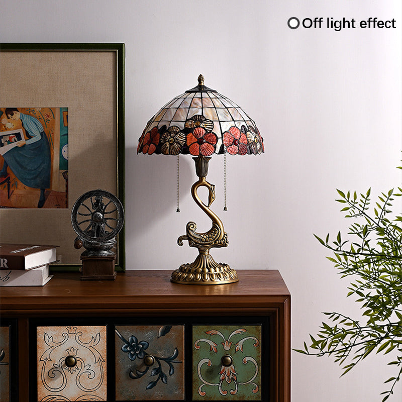 Elegant Swan Brass Table Lamp in a cozy living room setting, providing soft ambient lighting.